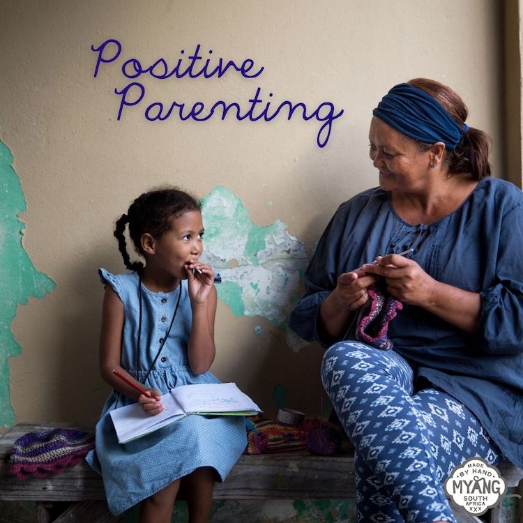 positive parenting: a mom and daughter talking while the mom works